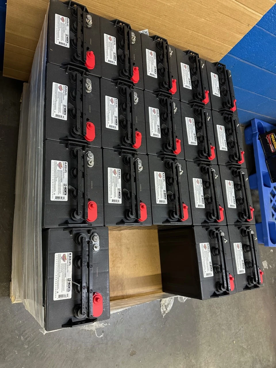 Black batteries with red terminal covers at Gayle Battery